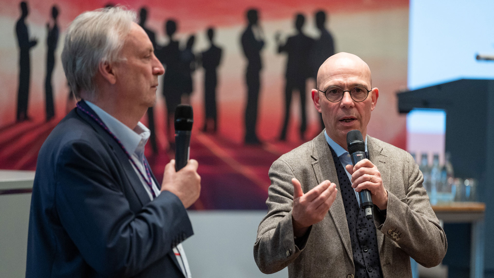 Moderators of the conference on stage.