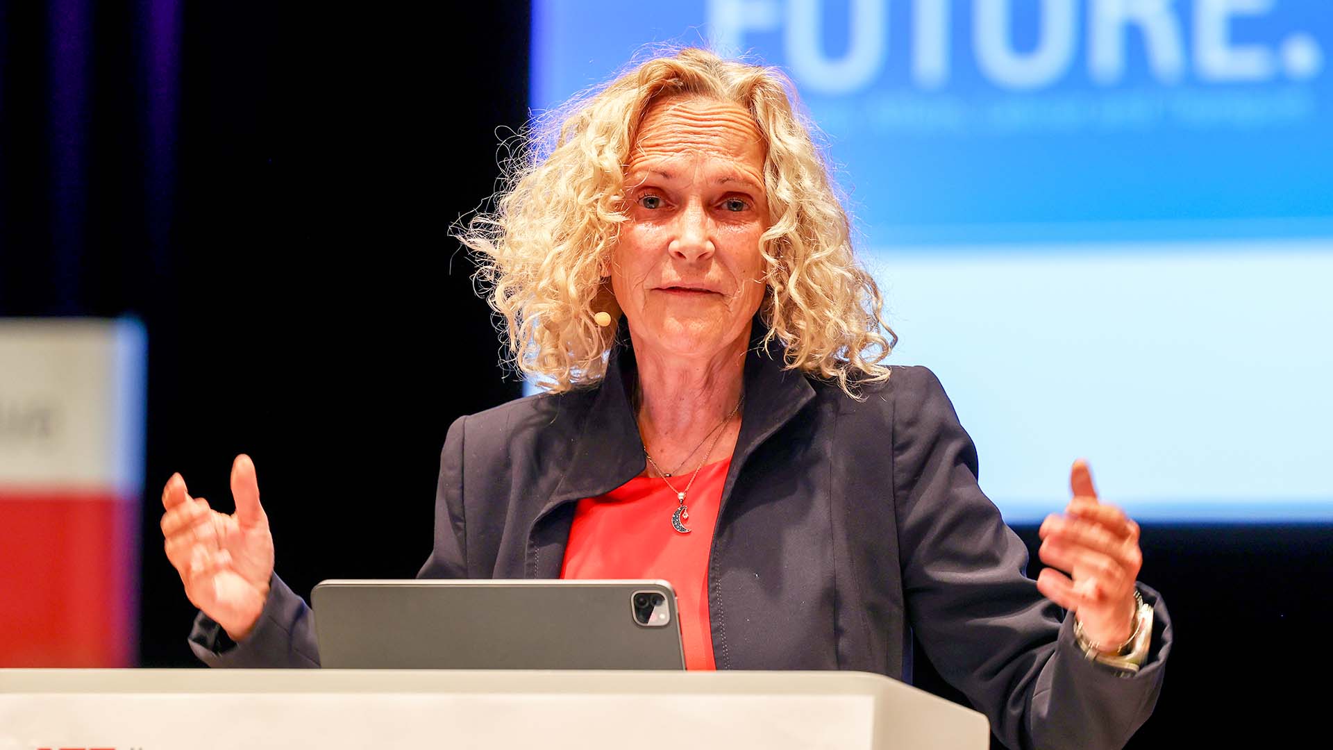 Speaker during her presentation at the speaker's desk