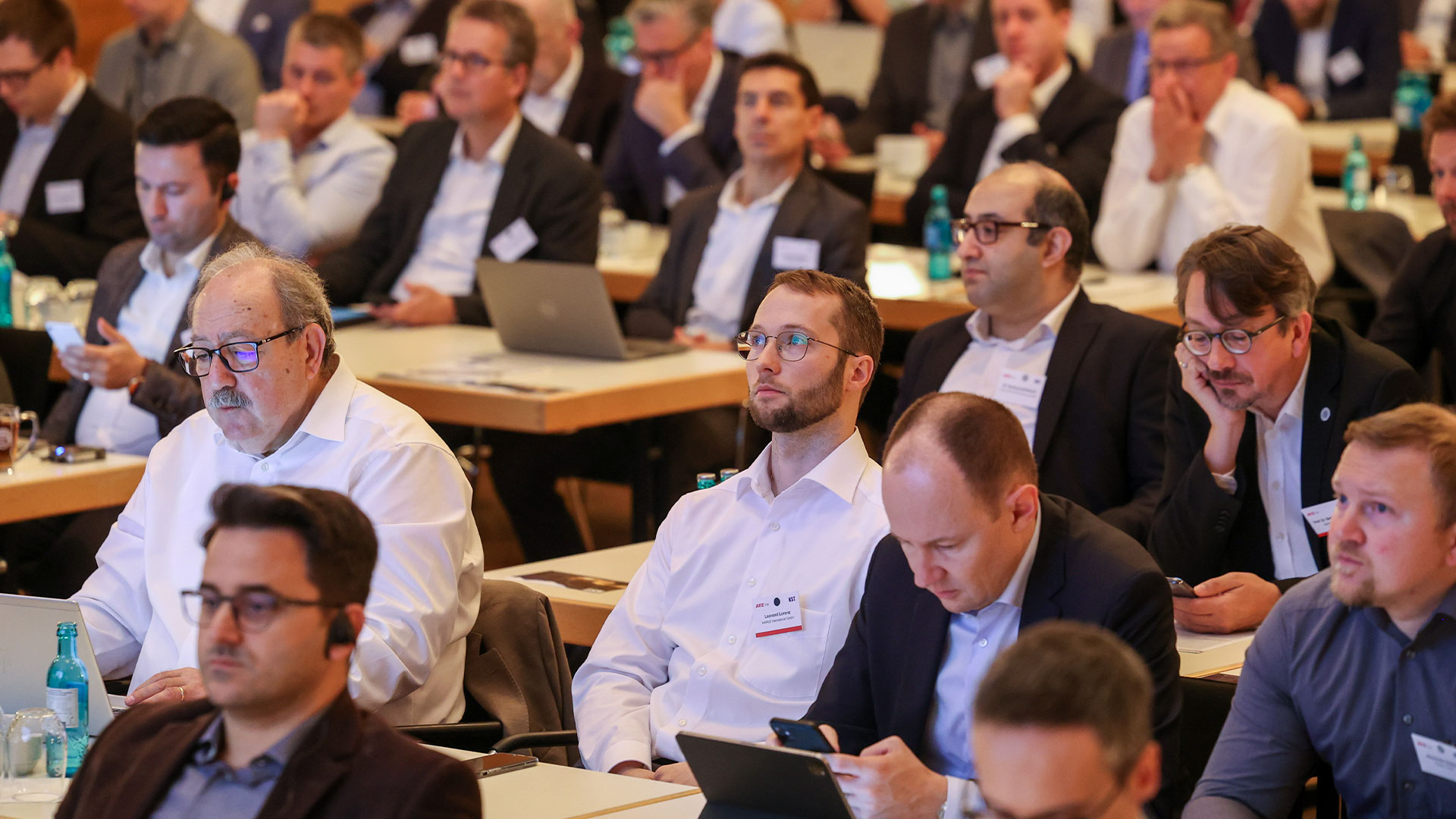 Conference participants sitting in the plenum
