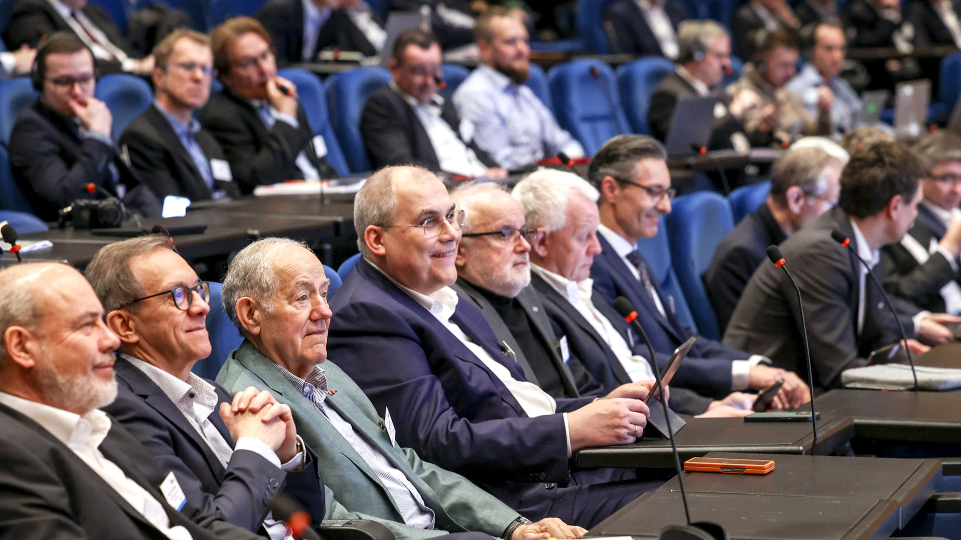 Conference participants sitting in the plenum