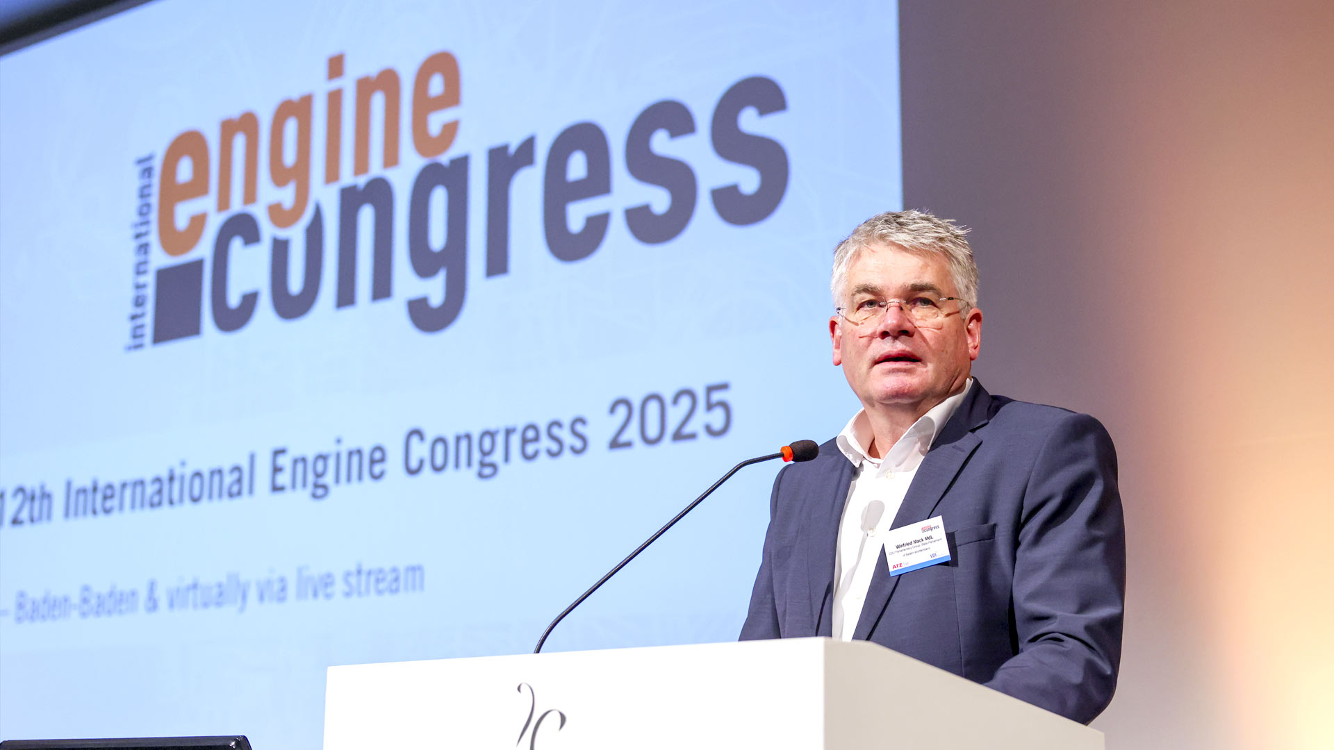 Speaker during his presentation on stage.