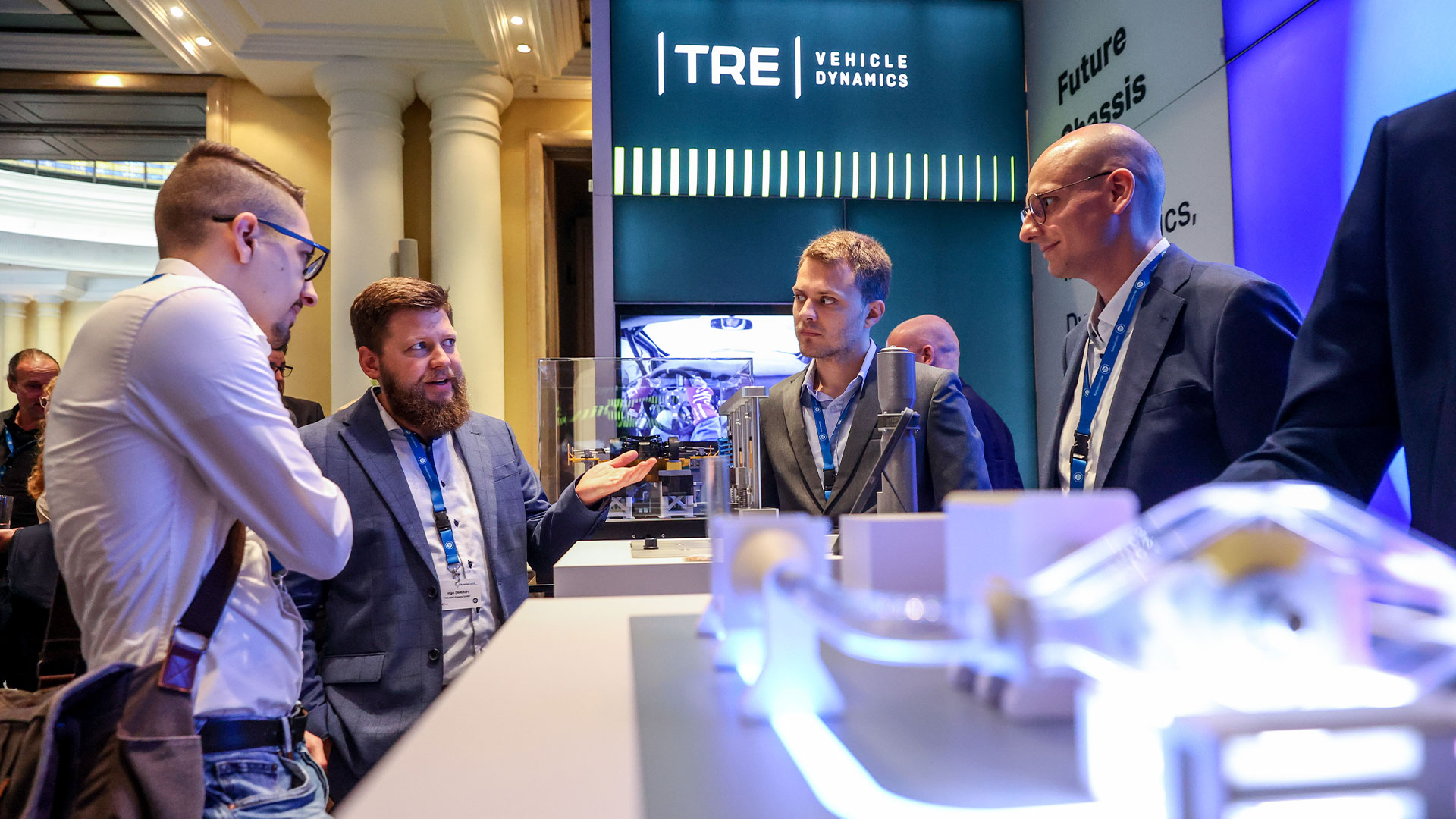 Four gentlemen in conversation at the exhibition stand of TRE.